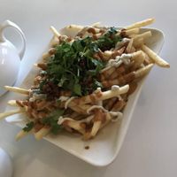 Mex Fries with ranch, chipotle, pico, "carne" crumbles, and cilantro. at Loving Hut in Upland
