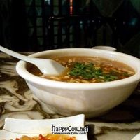 Hot and sour soup. This was huge, very cheap, and  and very tasty. Recommended. Foreground: pickles. at GōngDé Lín - Godly - Nanjing Rd in Shanghai