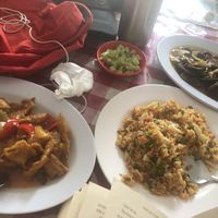 Fried rice, crispy pork and sweet and sour chicken  at Happy Buddha in Kuta