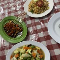 Fried rice, chicken satay & mixed vegetables  at Happy Buddha in Kuta