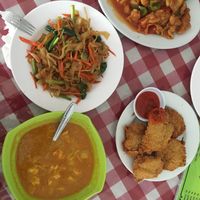 Chicken curry, kentucky, fried noddles and sweet sour chicken at Happy Buddha in Kuta