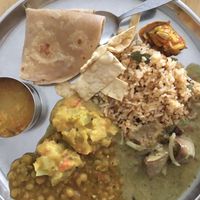 Sesame rice, chapati, green pea dhal, potato subzi, rasam and brinjal curry with papadam chips.  at Annalakshmi Temple of Fine Arts in Penang