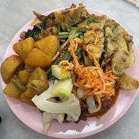 Lots of variety of all vegetarian dishes. Load up your plate, order a drink and take it to the counter. This big plate plus an ice coffee costed just 17MYR / £2.83! Delicious!  at Ee Beng Vegetarian Food 毅明素食 in Penang