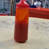 Chilli sauce on tables at Ee Beng Vegetarian Food 毅明素食 in Penang