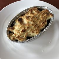 spinach and onion topped with vegan cheese  at Chamlong's / The Vegetarian Society Chatuchak in Bangkok