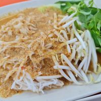 Rice vermicelli with vegan fish curry and Bai Yanang leaves. at Rabiengboon - MBK in Bangkok