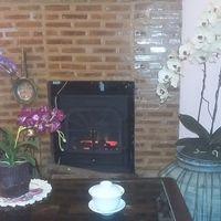 Interior, electrical fireplace at The Vegetarian Cottage in Bangkok