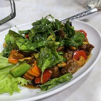 Chicken with cashew, topped with fried basil leaves   at Ruyi Vegetarian in Bangkok