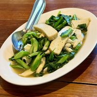 Chinese Kale stir fry with mushrooms and tofu  at Aum in Chiang Mai