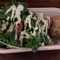 Rice ball with salad at Iku Wholefood Kitchen in Glebe