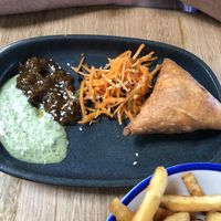 traditional Indian pastry filled with mild vegetable curry, served with a refreshing Bombay carrot salad, tamarind chutney & coriander chilli coconut yoghurt. (1 per serve). $9.50 at Vegie Bar in Fitzroy