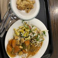 A mix of curries, salad and rice with a dessert of apple crumble and a drink all for $12.50  at Gopals in Melbourne
