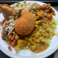 Not so hungry plate ( peanut butter curry, Indian curry) with quinoa and chickpea salad. Added a samosa and kidney bean croquette. Indian curry bland. PB curry just tastes hot at Gopals in Melbourne