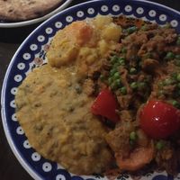 Seitan stew with lentil dhal and veggies, naan bread  at Bio Bistro Spicy Spices in Salzburg