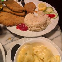 wiener schnitzel with rice and potato salad at Rupp's Vegetarisches Pub   in Vienna