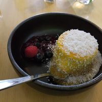 Vegan Panna Cotta (coconut based) with fresh berries and coconut flakes at Hollerei in Vienna