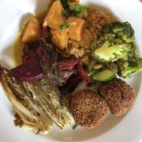 Quinoa, squash curry, bean croquettes, grilled endive and beetroot and greens.  at Lekker GEC in Ghent