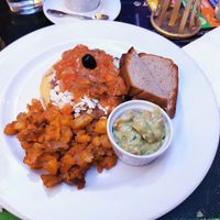 HUEVOS RANCHEROS -
corn tortilla with beans, mixed tofu,
salsa and guacamole. at Radost FX Cafe in Prague