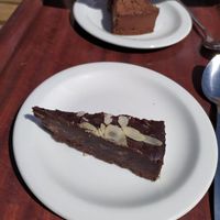 Raw chocolate cake and cheesecake at Infinity Foods Kitchen in Brighton