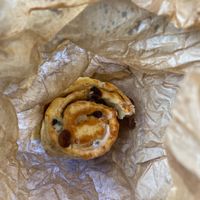 partially eaten chelsea bun in the bag, sorry!   at Infinity Foods in Brighton