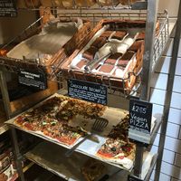 Vegan pizza in a shop bakery!  at Infinity Foods in Brighton