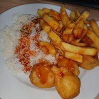 Vegan chicken balls, chicken chow mein, chips and boiled rice. at Veggie World in Milton Keynes