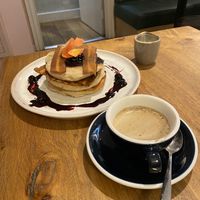 Blue berry pancakes, latte  at Mildreds - Soho in London