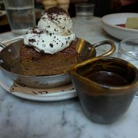 7.5 Baked blondie with chocolate and ice cream - more so a sponge cake with chocolate and ice cream gave school dins vibes not in a bad way at Mildreds - Soho in London
