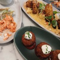 🥟kimchi gyoza dumplings
korean cabbage carrot ferment, sweet gochujang sesame sauce, scallion ginger oil
🌱chorizo arancini
crumbed risotto fritters, aioli, chipotle ketchup
🌽coconut corn ribs
lime leaf dressing, mango lime yogurt, mango chil at Mildreds - Soho in London
