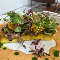 Chipotle Wild Mushrooms—sautéed with shallots and thyme in creamy chipotle sauce, served with polenta cake and grilled courgette ribbons at The Gate - Hammersmith in West London