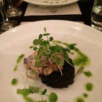 Black Rice Cake on Wilted Greens and Creamy Mushrooms. at The Gate - Hammersmith in West London