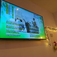 Supreme Master TV. If you know, you know! This is top entertainment. at Loving Hut in North London