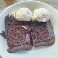 Warm chocolate fudge cake with ice cream at Riverside Vegetaria in Kingston Upon Thames