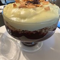 Berry crumble with custard. So good tart and sweet ! at Manna London Restaurant - Maybe closed in North West London