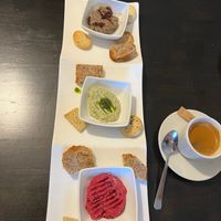 Sharing platter of homemade dips and bread/crackers at Manna London Restaurant - Maybe closed in North West London