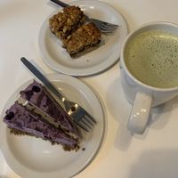 Raw blueberry cheesecake, oat date dessert and matcha latte   at Earth Cafe in Manchester