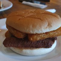 Vegan sausage and has brown toasted bap at Fuel in Manchester