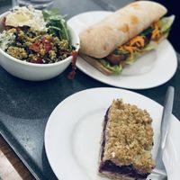 Salad, banh mi, and mixed berry crumble  at The 8th Day in Manchester