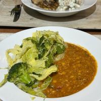 Dahl rice & greens, moussaka and potato salad at The 8th Day in Manchester