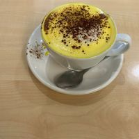 Turmeric latte at The 8th Day in Manchester