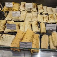 Shop's deli counter at The 8th Day in Manchester