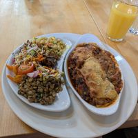 Lasagna with a trio of side salads at The Whale Tail Cafe in Lancaster