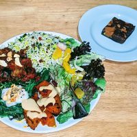 Imam bayeldi, rice with barberries & herbs, roast pumpkin with harissa & sweet tahini, wilted spinach with yogurt/dukkah, orange/fennel salad.
Chocolate, & cranberry brownie at Blue Moon Cafe in Sheffield
