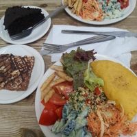 Jamaica pattie with salad, roast butternut squash, chick pea and red peppee bake, both served with salads. peanut butter blondie and dark choc cake at Blue Moon Cafe in Sheffield