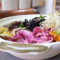 Bowl served in the restaurant: two cereals, one legume, pickels, vegetables at Grand Appetit in Paris