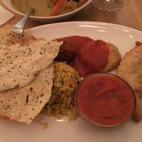 Thali - it’s a lot of food including a little dessert (hiding under poppadum) at Prinz Myshkin City in Munich