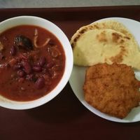 Spicy sabji, naan bread and deep fried potato donut at Govinda I in Budapest