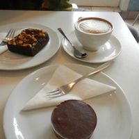 Vegan banana and spelt brownie, soy cappuccino, and vegan 'snickers' raw pie cup at Kaffihusid Gardurinn - Ecstasy's Heart-Garden in Reykjavik