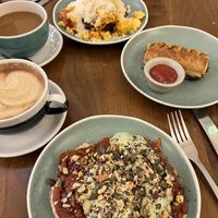 Vegan tofu scramble, vegan sausage roll, and beans on toast with an oat milk latte & americano  at Cornucopia in Dublin