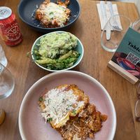 We both got the lasagna. It was AMAZING 😍 The bowl in the middle is a mix of two salads. One was the potato salad and the other was pesto pasta. Both were delicious 🥰 at Cornucopia in Dublin